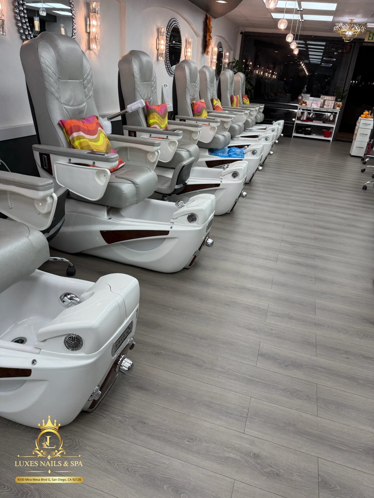 The real Luxe Nails & Spa salon with white pedicure chairs in Mira Mesa